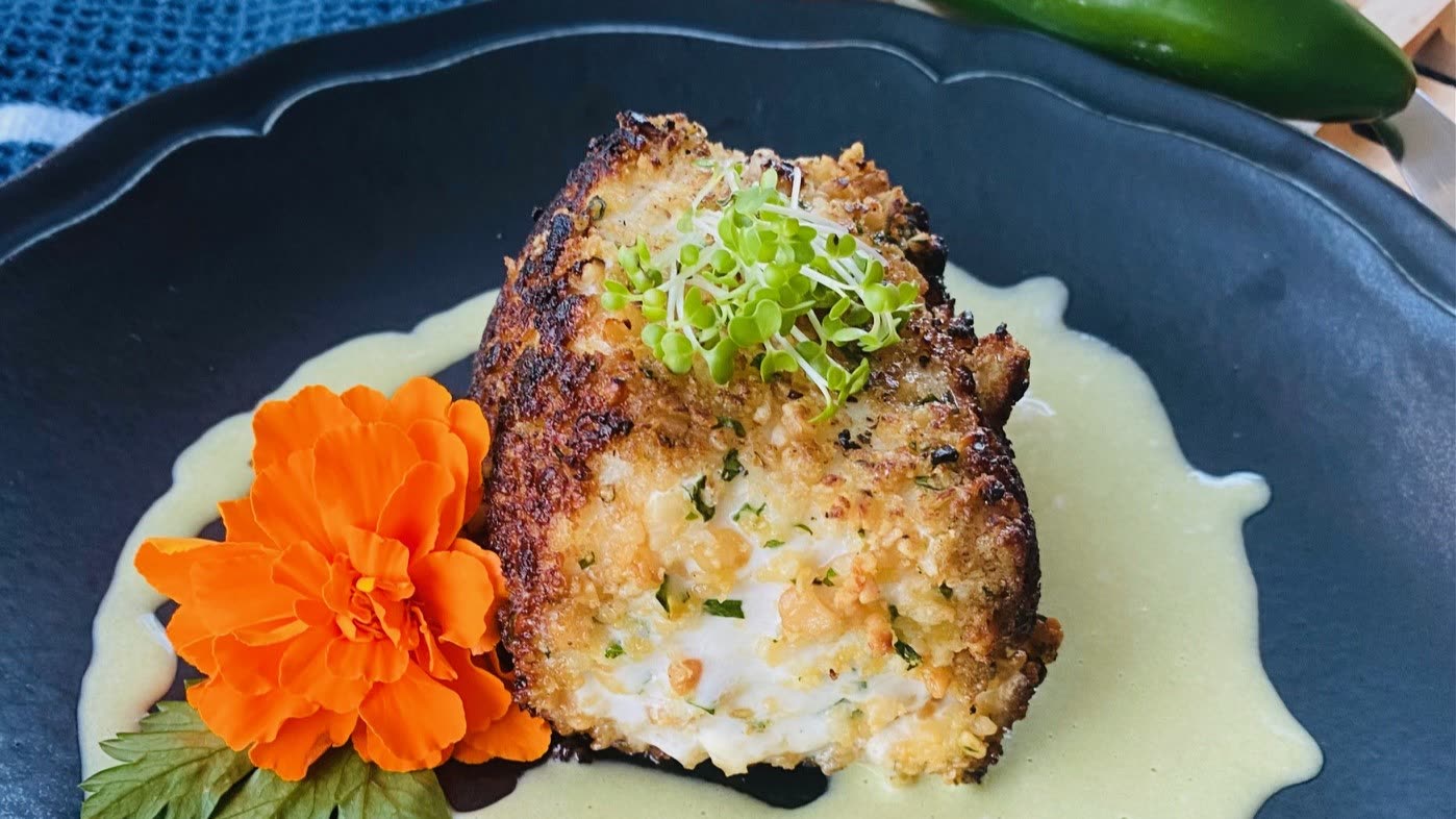 Macadamia nut crusted halibut fillet with lemon, a gluten free keto recipe by Chef Monika Jensen