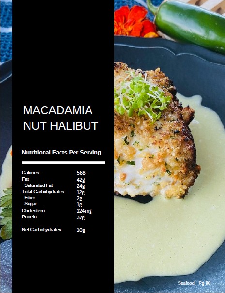 Macadamia nut crusted halibut on herb cream sauce photographed for page 90 of The Balanced Plate cookbook, shown with its nutritional facts label of 568 calories and 10 g net carbs per serving